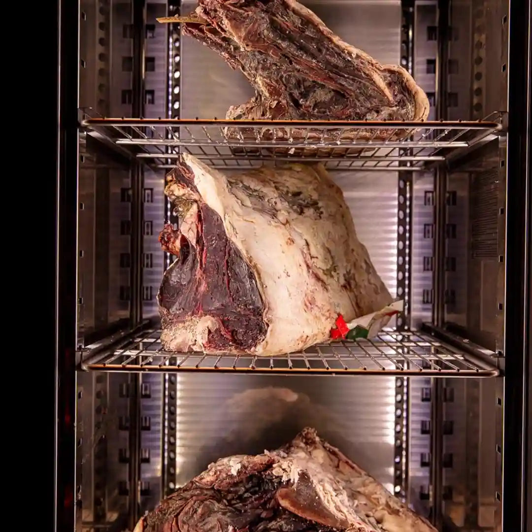 A rack of assorted meats displayed in a refrigerator at temper Restaurant, a Central London steakhouse